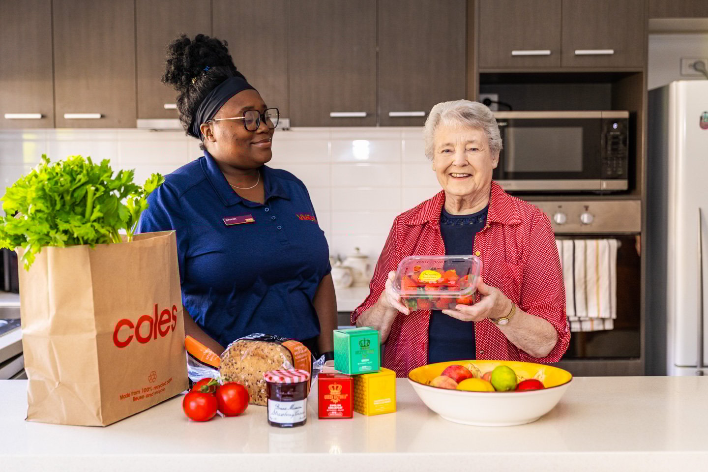An older lady and a home care support worker in the kitchen