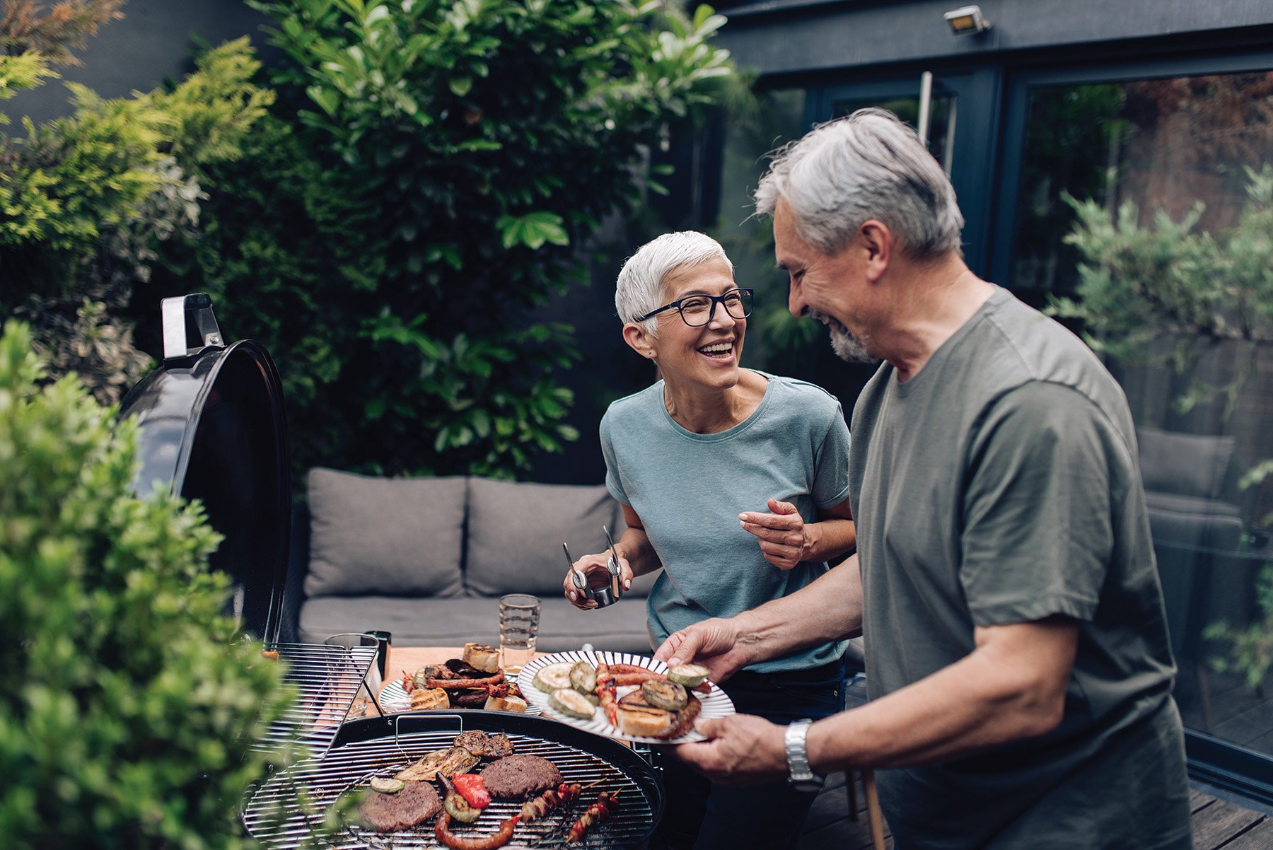 Couple at barbecue laughing