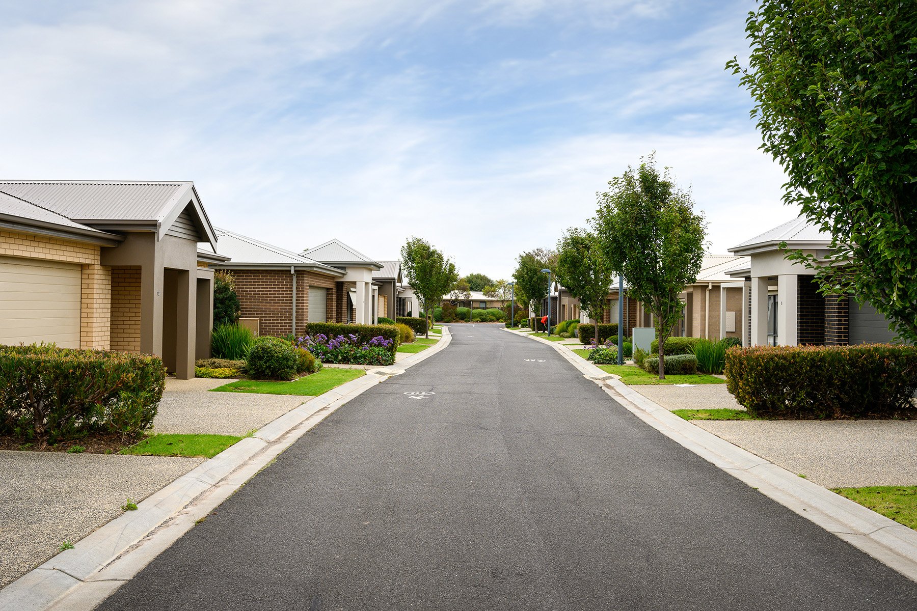 Star of the Sea view down street with cream and beige houses